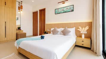 A modern bedroom with a large bed, wooden wardrobe, bedside tables, and a nightstand with decorative items.