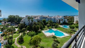 A resort with multiple swimming pools, lush greenery, and a view of the sea. - The Diamond Of Puerto Banus With Seaviews (Marbella)
