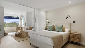 A modern bedroom with a large bed, bedside tables, a desk, and a view of the outdoors. - Medina Garden 342 in Puerto Ban s - Marbella (Marbella)