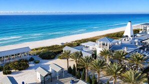A coastal hotel with a beach view, multiple guest rooms, and a prominent lighthouse structure. - Escape to Paradise along the Emerald Coast (Rosemary Beach)