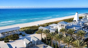 A coastal hotel with a beach view, multiple guest rooms, and a prominent lighthouse structure. - Escape to Paradise along the Emerald Coast (Rosemary Beach)