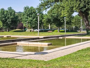 A landscaped area with rectangular water features, benches, and street lamps. - Picturesque Villa with Private Pool by Interhome (Alvite)