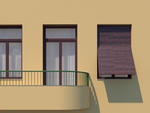 A building facade with three windows, one with a closed shutter, and a balcony with a green railing. - Suite 11 Athens (Athina)