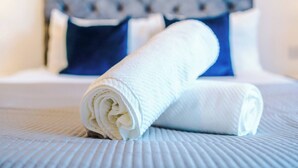 A neatly folded white towel on a textured bedspread. - #82 Stylish Shirley Home Sleeps 8 NEC Solihull BHX (Shirley)