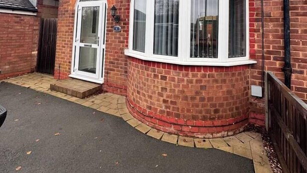 A two-story house with a red brick exterior, a bay window, and a white door. - #82 Stylish Shirley Home Sleeps 8 NEC Solihull BHX (Shirley)