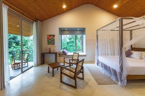A bedroom with a canopy bed, a balcony with a chair, and a view of greenery. - ONA Garden Villa: Deluxe Double/Twin Room (Galle)