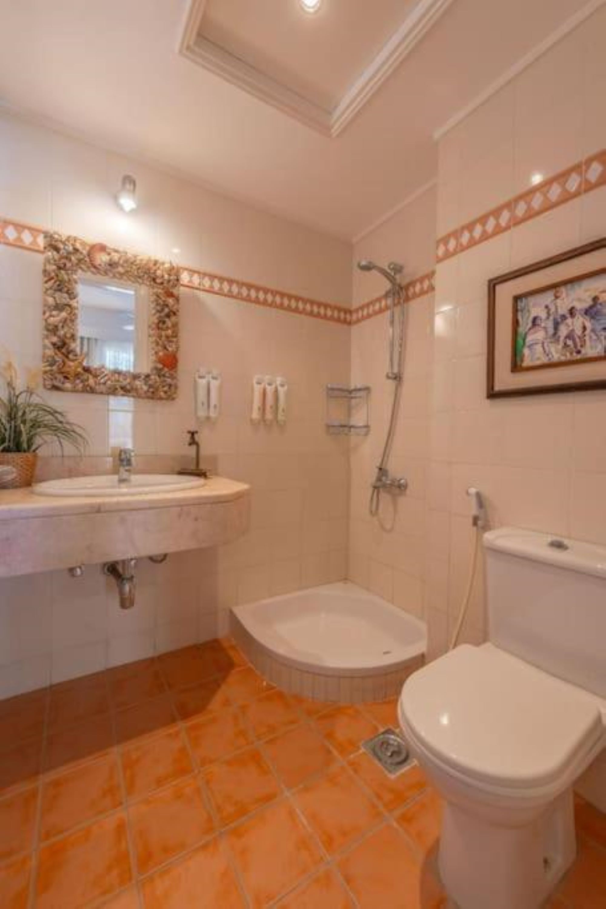 A bathroom with a bathtub, toilet, and sink.