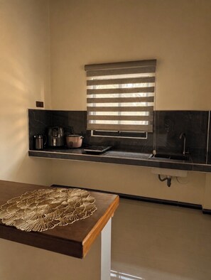 A kitchen with a window, a sink, and a coffee maker. - Welcome to SIORA Retreat, your home and safe place in dambulla (Dambulla)