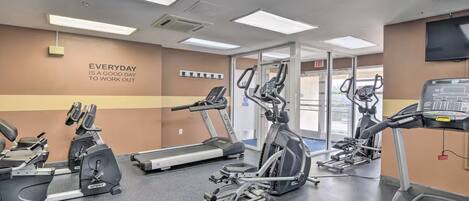 A gym with treadmills, ellipticals, and weight machines.