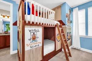 A bunk bed room with a ladder, a 'Wanted' poster, and a window with blinds. - Private south facing  Pool and Hot Tub-games room -ping pong-Close to disney (Lake Buena Vista)
