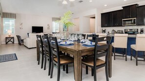 A modern kitchen with dark cabinetry, a built-in microwave, and a coffee maker. - New Listing! 6 miles Disney/Private Pool and Spa/Flowrider/Teen hangout (Kissimmee)