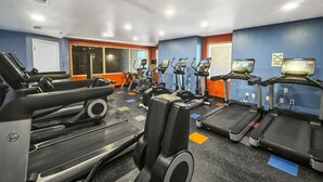 A gym with multiple cardio machines, including treadmills and ellipticals, arranged in rows. - High Tide Hideaway at Shores of Panama #1918 - Oceanfront, High-Rise, Pools, Covered Parking (Panama City Beach)