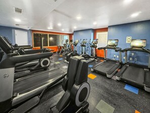 A gym with multiple cardio machines, including treadmills and ellipticals, arranged in rows. - High Tide Hideaway at Shores of Panama #1918 - Oceanfront, High-Rise, Pools, Covered Parking (Panama City Beach)