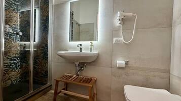 Shower, free toiletries, hair dryer, towels