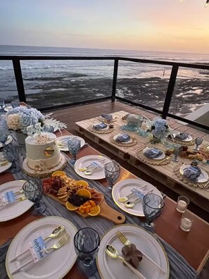 A table set for a meal with a view of the ocean. - JB King Ranch Beach House (La Libertad)