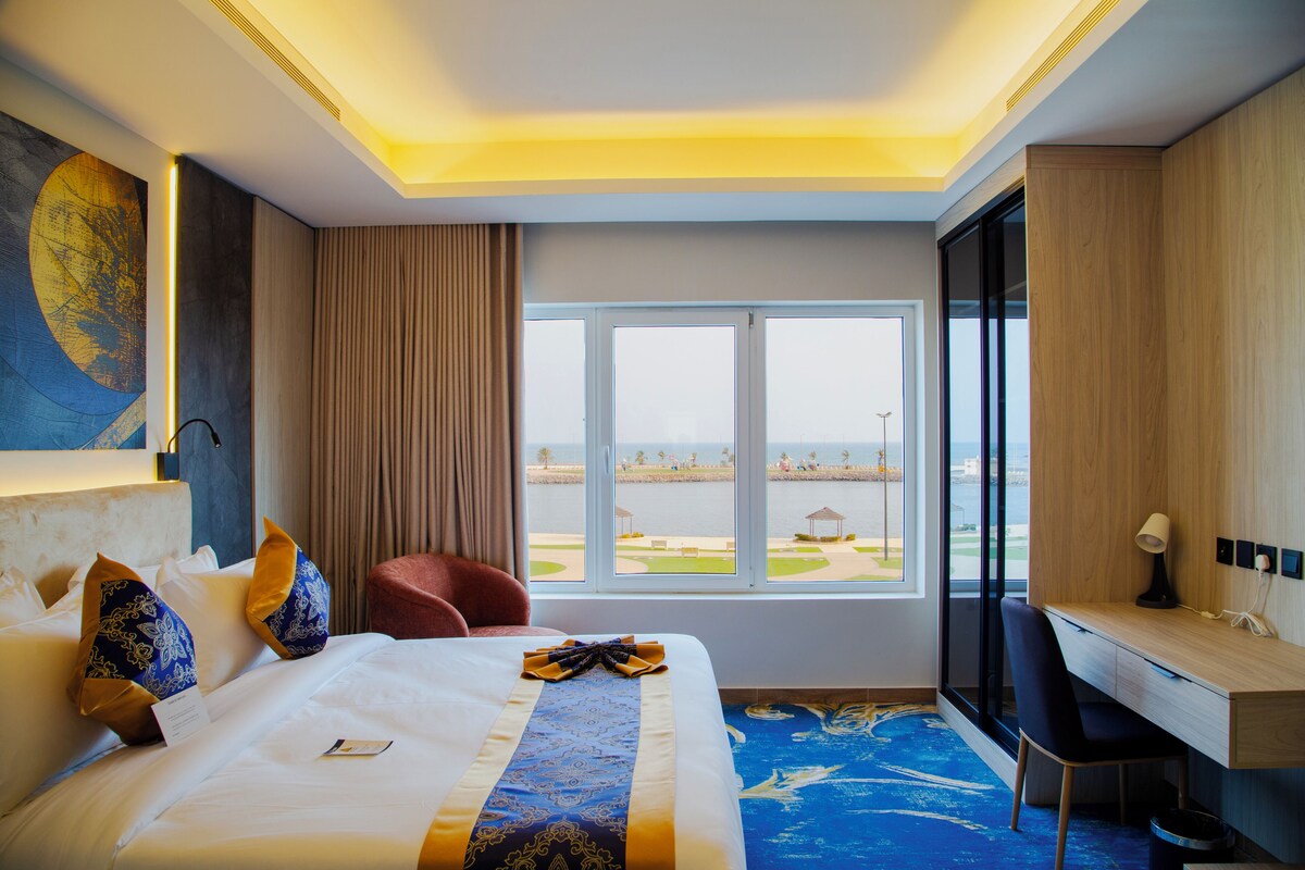 Deluxe Suite, Beach View | In-room safe, blackout curtains, iron/ironing board, bed sheets