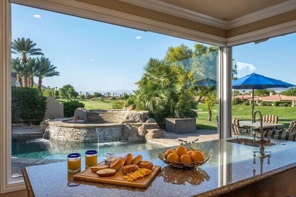 Golf Room: leather sectional sofa, 65` smart tv with built in media cabinet, wet bar with (4) bar stools, mini fridge - Fairway Peaks at PGA West | Mountain & Golf Views (La Quinta)