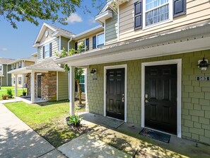 A residential building with a brick entrance, a porch, and a number 503 sign. - Nautilus Cove #503 (Panama City Beach)