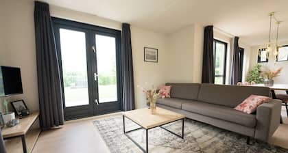 Goldenescape 6-person cottage with a hot tub and large garden.