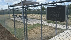 A fenced dog park with a sign indicating it is for large dogs. - Preston Royal Single II I Premium 1BR in Dallas (Dallas)