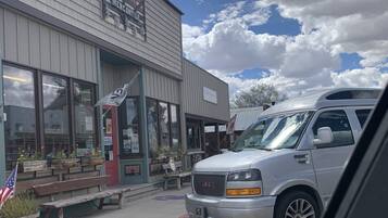 A building with a sign reading 'Mercantile' and a GMC truck parked in front.
