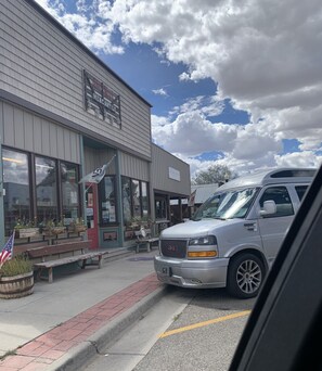 A building with a sign reading 'Mercantile' and a GMC truck parked in front.