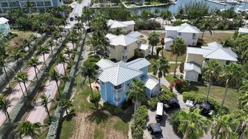 A resort with multiple buildings, a marina, and a beach area.