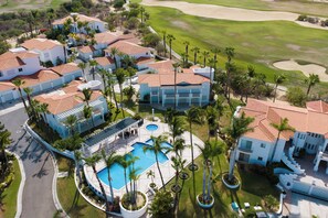 A resort with multiple buildings, a swimming pool, and a golf course. - New listing  - Stylish Palmilla 3-Bedroom Condo with Shared Pool (Palmilla)