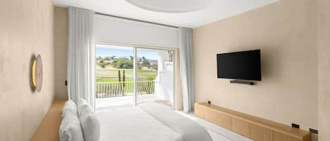 A modern bedroom with a bed, a TV, and a balcony with a view.