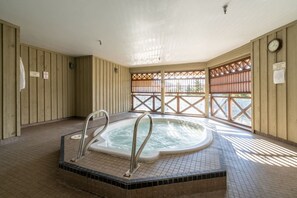 A hot tub in a room with wooden walls and a tiled floor. - Whistler Central |Free PKG&Hot Tub,Walk2Everything (Whistler)