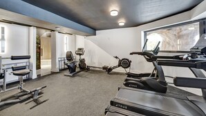 A gym with treadmills, stationary bikes, and weight machines. - Ocean View Condo in Beachfront Resort Beach, Pool, Gym 607 (Miami)