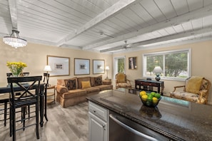 A spacious living area with a kitchen island, dining table, and seating. - Sun Valley Atelier Retreat - 5 minute walk to Sun Valley Pavilion (Sun Valley)