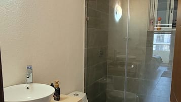 Shower, towels, soap, toilet paper