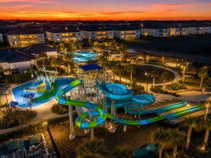 A water park with multiple slides and a pool, surrounded by residential buildings. - 5-bedroom 2 MINUTE WALK TO RESORT (Davenport)