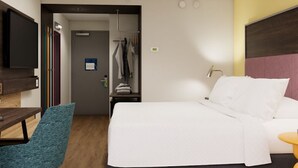 A hotel room with a bed, a desk with a chair, a television, and a wardrobe. - Tru By Hilton Shippensburg (Shippensburg)