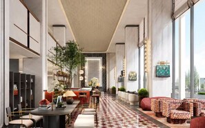 A modern hotel lobby with a reception desk, seating area, and large windows. - Anor And Saffron Tashkent, Curio Collection By Hilton (Tashkent)