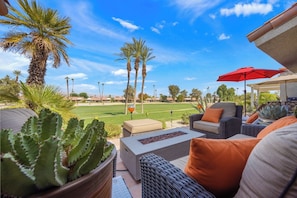 Spacious back patio with ample seating - Bright Golf View Villa: Vaulted Ceilings, Patio Dining, Mtn Views & Resort Pool (Palm Desert)