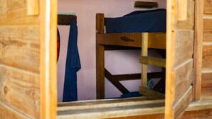 A wooden bunk bed room with a single bed on top and a lower bunk. - Hostel Bocas Estrella (Bocas del Toro)