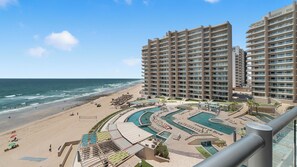 A beachfront hotel with multiple swimming pools, a beach, and ocean views. - Las Palomas Phase II Coronado 506 Exceptional Oceanfront 2BR 2BA Unit. (Puerto Peñasco)