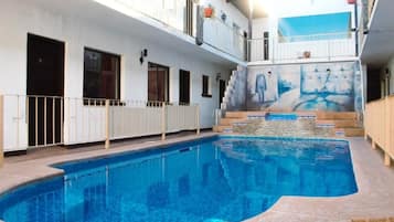 Seasonal outdoor pool, open 8:00 AM to 10:00 PM, pool umbrellas