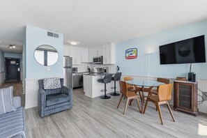 A modern apartment with a kitchen, dining area, and living space. - 0704 Beach Life-Free Activities Included (Carolina Beach)