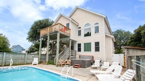 A two-story house with a swimming pool, deck chairs, and a hot tub. - Soundside- Golf Community, Priv Pool, Htub-MB3, How Sweet the Sound (Corolla)