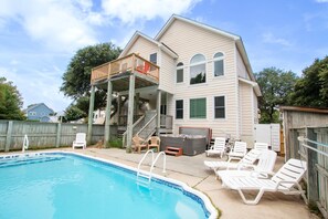 A two-story house with a swimming pool, deck chairs, and a hot tub. - Soundside- Golf Community, Priv Pool, Htub-MB3, How Sweet the Sound (Corolla)