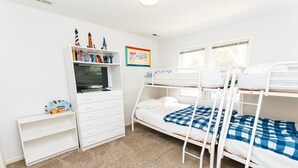 A child's bedroom with bunk beds, a bookshelf, and a desk. - Soundside- Golf Community, Priv Pool, Htub-MB3, How Sweet the Sound (Corolla)