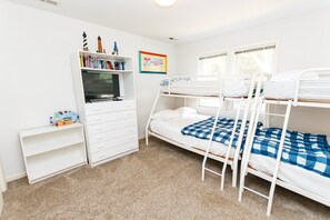A child's bedroom with bunk beds, a bookshelf, and a desk. - Soundside- Golf Community, Priv Pool, Htub-MB3, How Sweet the Sound (Corolla)