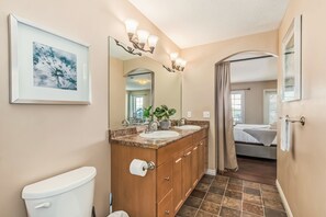 A bathroom with a toilet, double sinks, a mirror, and a framed artwork. - Million Dollar Home In Lewis Estaes Golf Course By Henday/Whitemud with Garage! (Edmonton)
