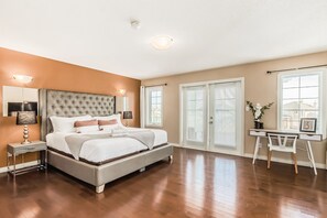 A bedroom with a large bed, a desk, and a chair. - Million Dollar Home In Lewis Estaes Golf Course By Henday/Whitemud with Garage! (Edmonton)