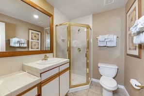 A bathroom with a glass-enclosed shower, a white sink, and a toilet. - Charming resort at the mountain at Lake Tahoe, near casinos - LABOR DAY week (Stateline)