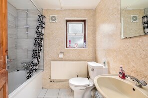 A bathroom with a shower, toilet, and sink. - Stratford 4-Bed House, Sleeps 8 with Garden (London)