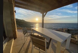 Outdoor dining - A waterfront village with a sunset (Algajola)